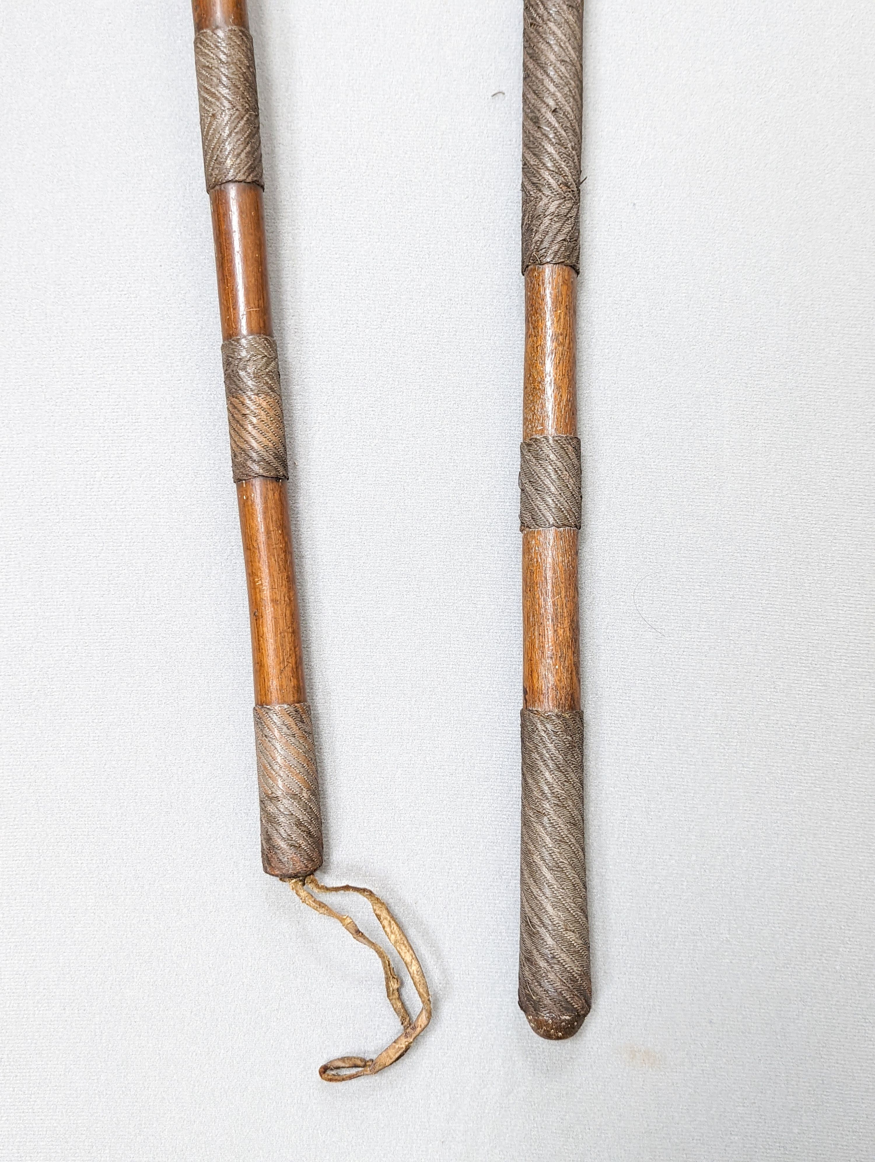 A Zulu hardwood, braided wire and studded knobkerrie and a similar axe 79cm